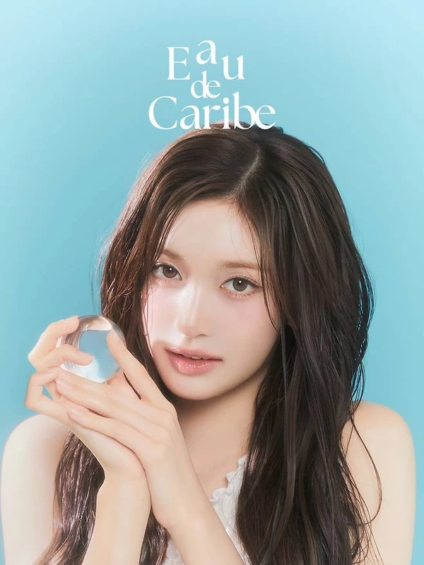 Close-up campaign portrait holding a clear sphere.