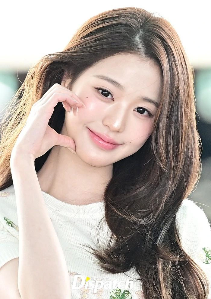 Wonyoung making a cheek-heart gesture at Incheon International Airport