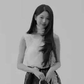 Wonyoung in a black-and-white studio frame from the Dior broadcast