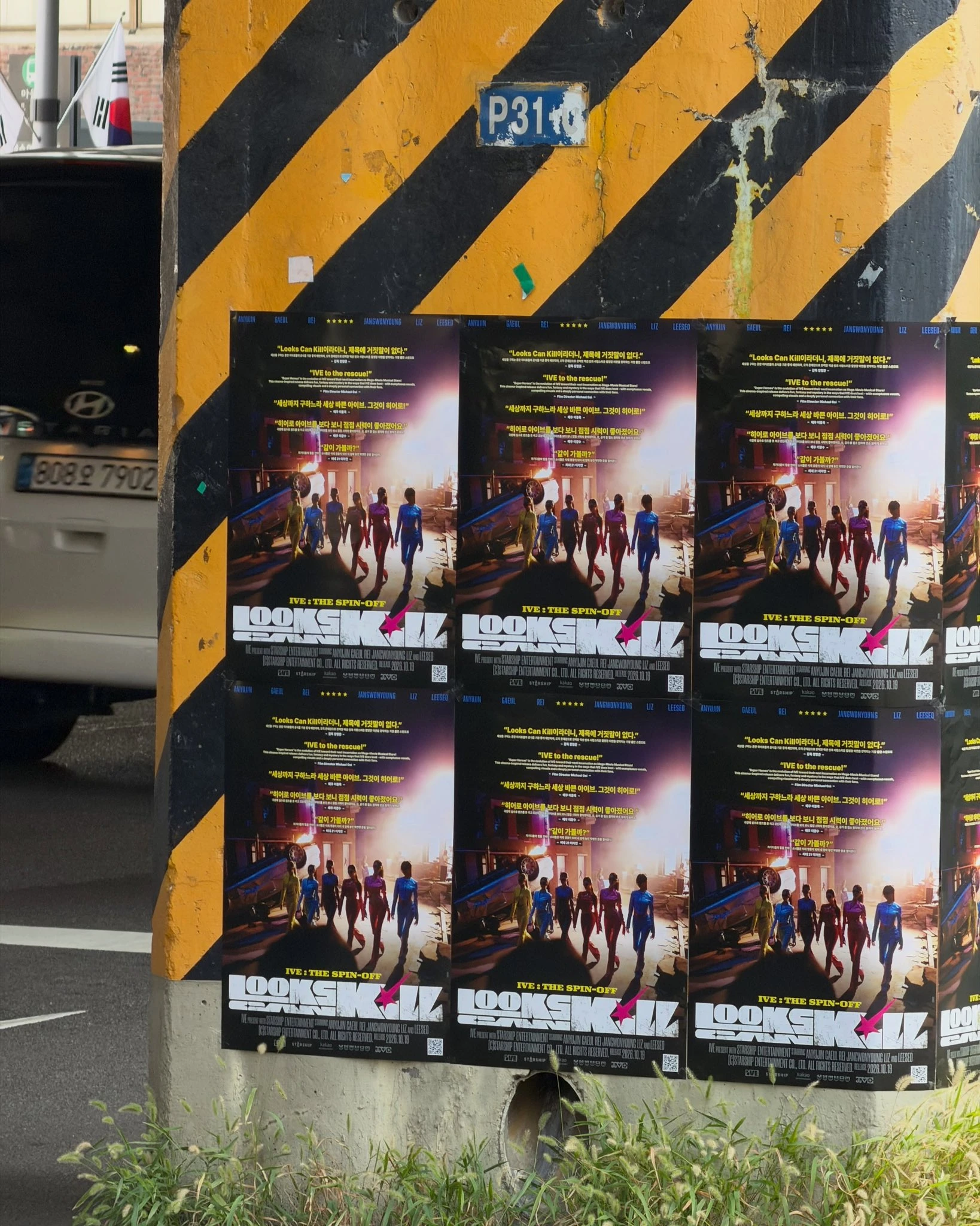 Looks Can Kill posters displayed on a yellow-and-black street wall