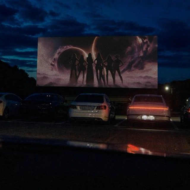 Six hero silhouettes on an outdoor cinema screen in IVE’s new teaser campaign
