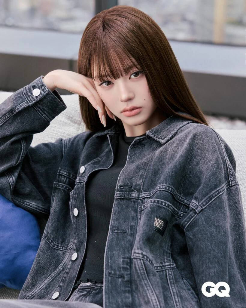 Wonyoung posing in a black Tommy Jeans Archive Trucker Jacket