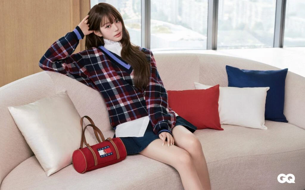 Wonyoung in a check Tommy Jeans sweater with a red duffle bag